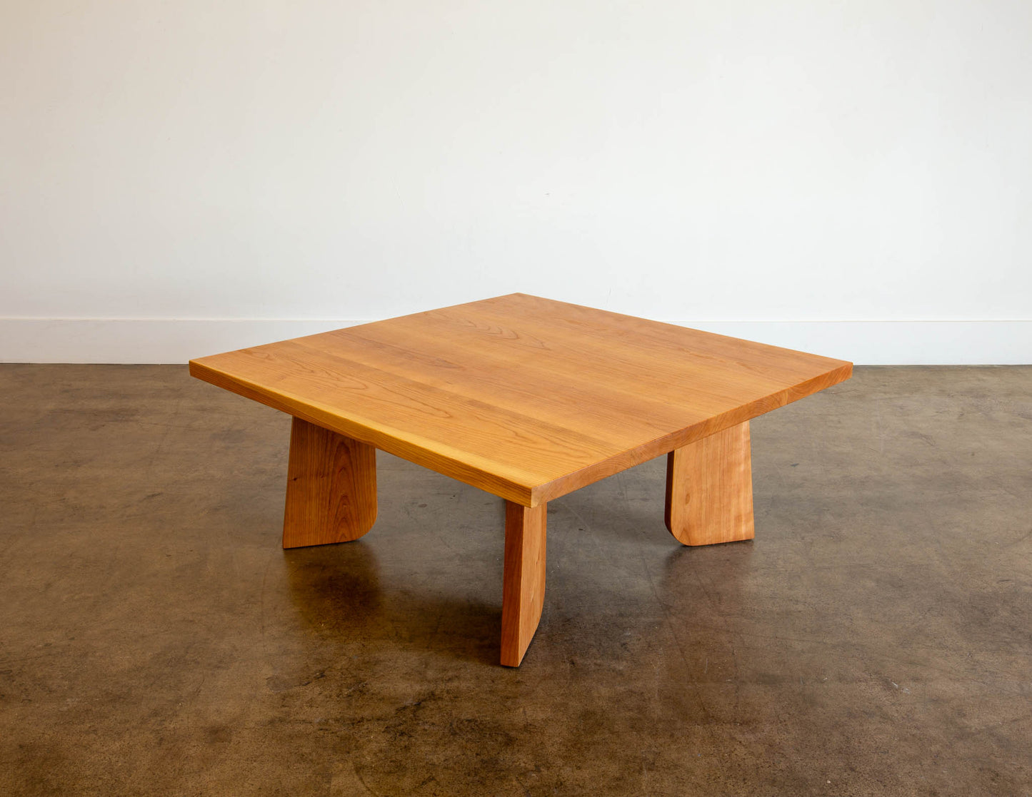 A full view of the hand-built Snyder DePass Temple Coffee Table, crafted from solid Cherry. The table features a clean, minimalist design with a low-profile silhouette.