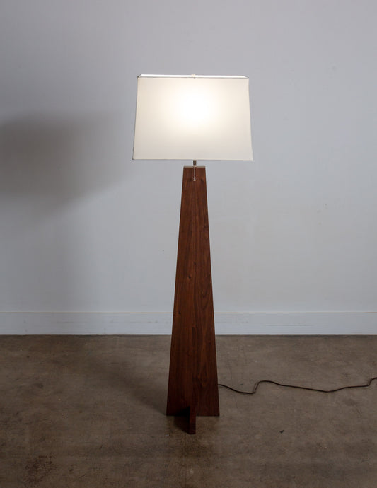 A hand-built Snyder DePass Pas Floor Lamp, featuring a unique, asymmetric design with a solid wood body and a clean, sculptural silhouette.