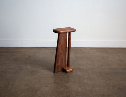 A hand-built Snyder DePass Walnut Drink Table, showcasing its slender profile, minimalist design, and the beautiful grain of the solid Walnut wood.